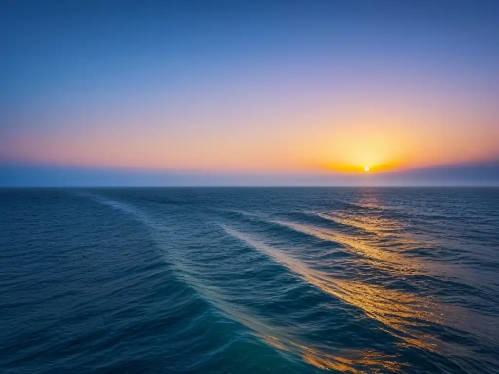 Un océano tranquilo al atardecer, con un horizonte suavemente iluminado reflejándose en el agua calmada, transmite paz y relajación